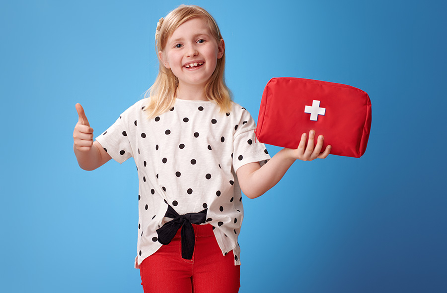 girl with first aid kit